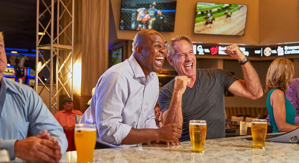 Two men betting on sports at Turfway Racing & Gaming